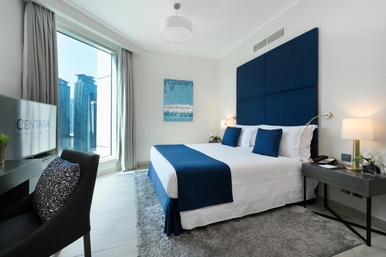Centara West Bay Hotel & Residences Dauhá Exteriér fotografie A bedroom at the Address Downtown Hotel