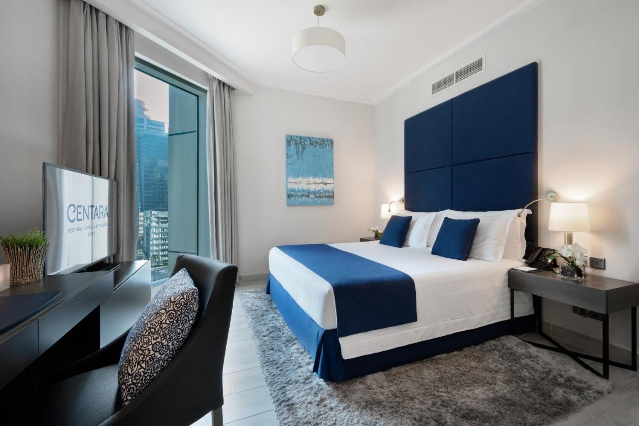 Centara West Bay Hotel & Residences Dauhá Exteriér fotografie A bedroom at the Address Downtown Hotel